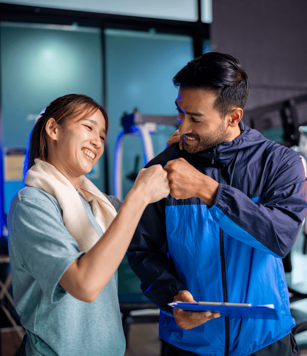 Trainer going over a schedule with a gym member